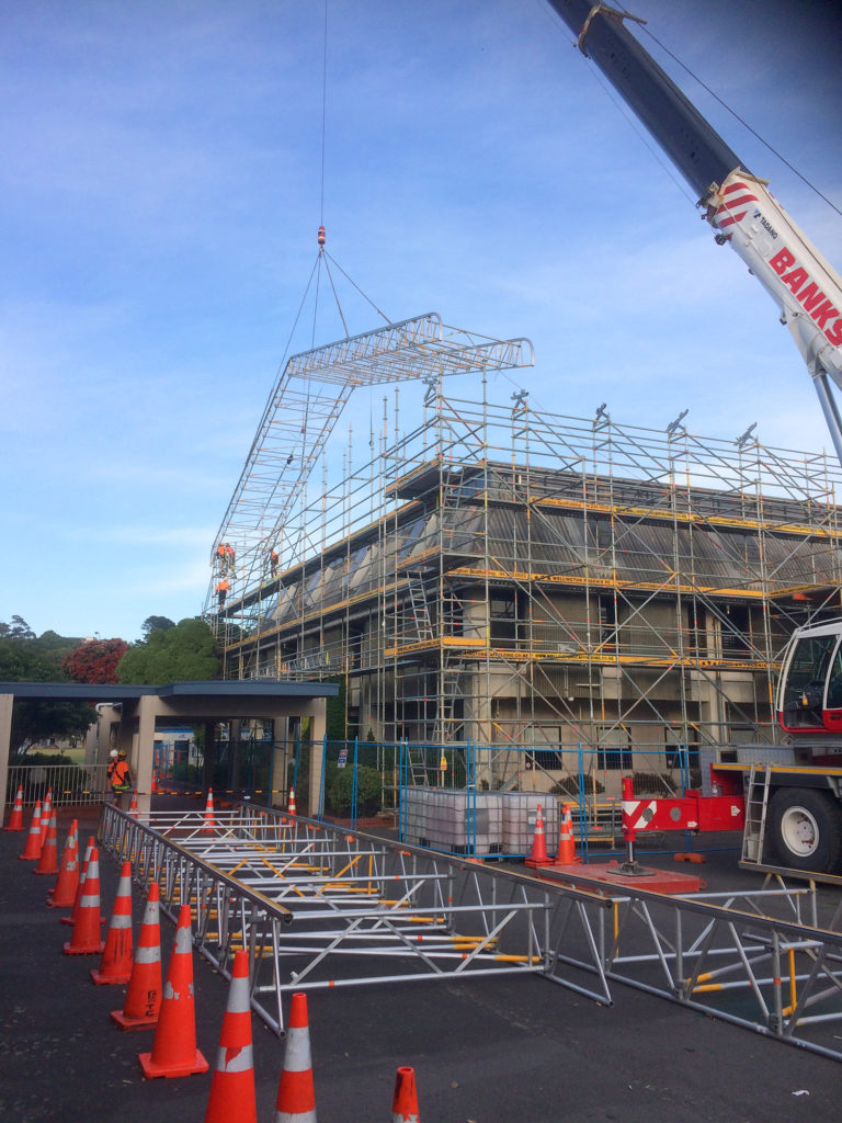 Temporary roof safely constructed on the ground and craned into position