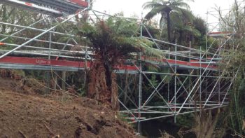 bridge of scaffolding over river