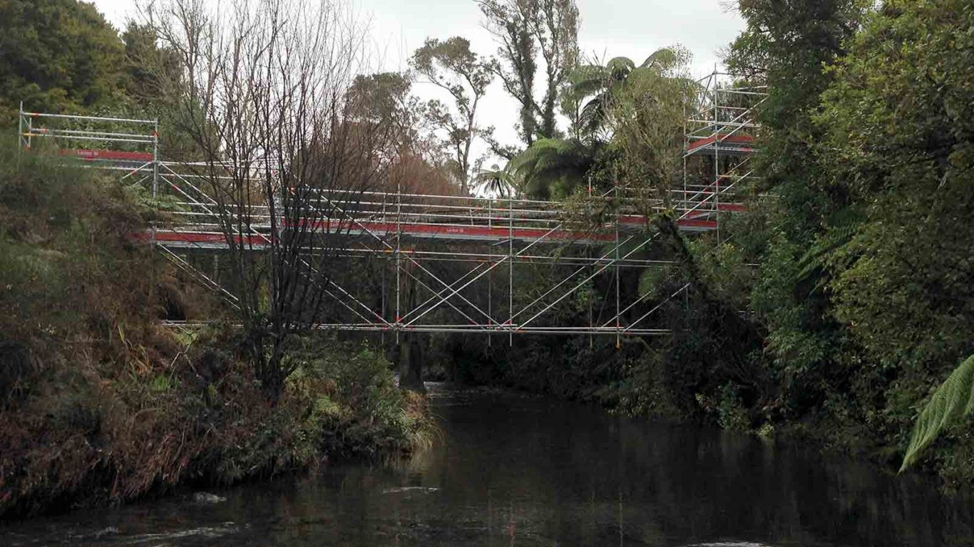 Temporary bridge, made from Layher scaffolding, for pipe maintenance over Patea River by Clearway Scaffolding